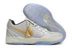 Gray and gold Ja 2 shoe side profile with the outsole visible.