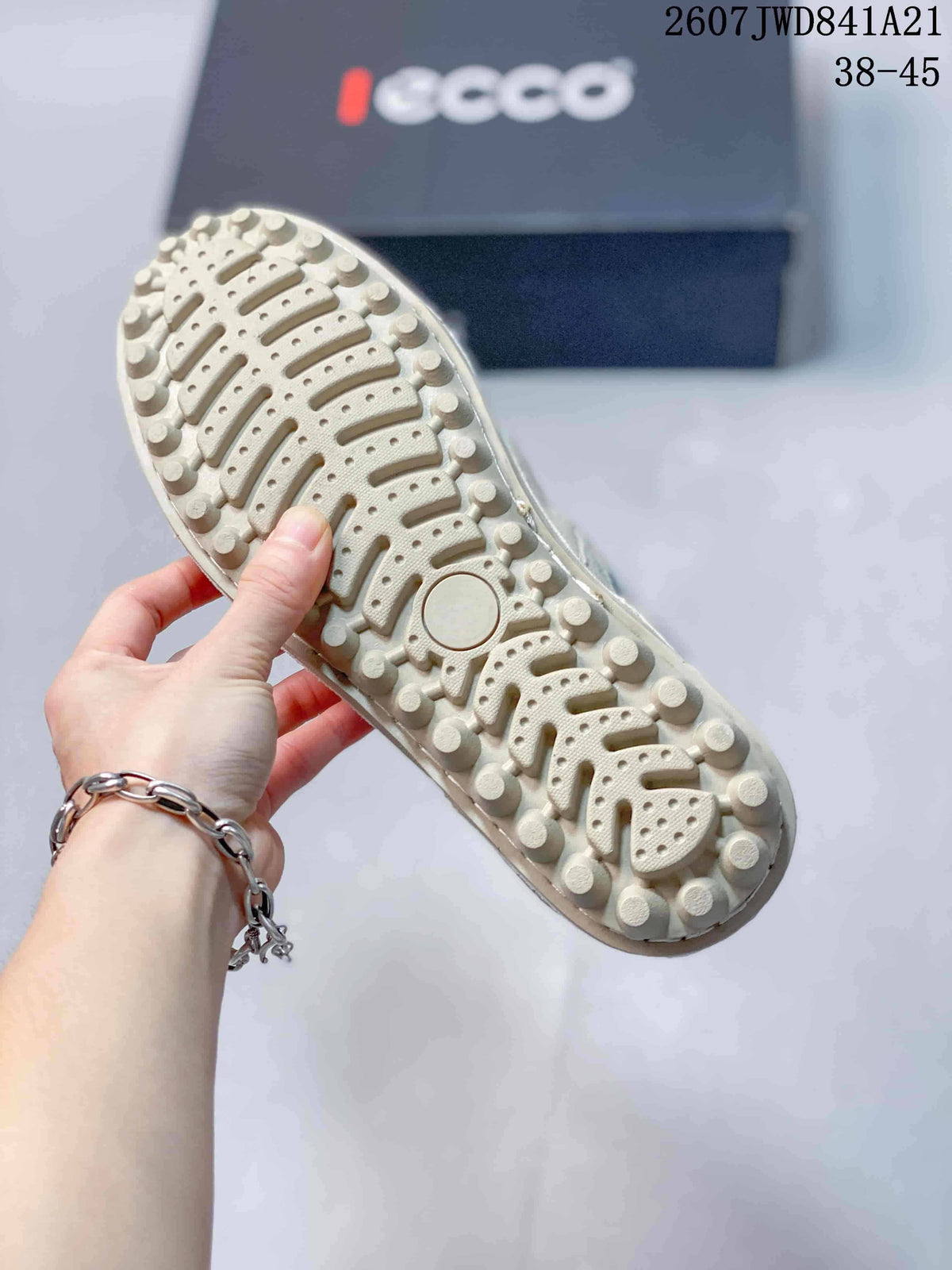 Close-up of the sneaker outsole showing raised circular and segmented tread elements.