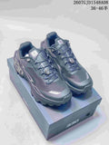Pair of dark gray Kailas Fuga Ex 330 trail shoes displayed on a shoe box, with product code and size range overlaid.
