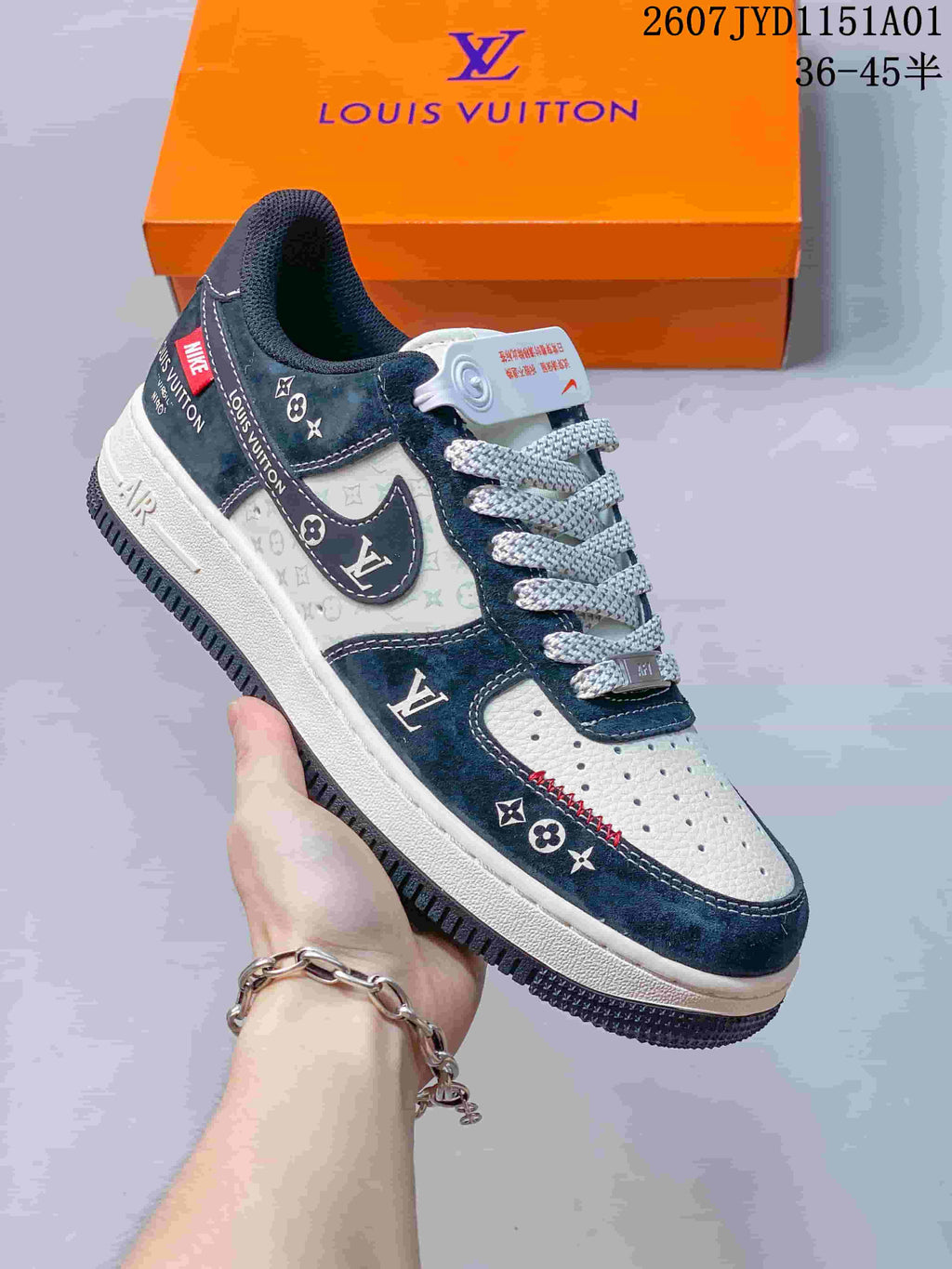 Close-up of a white and navy low-top sneaker with patterned panels
