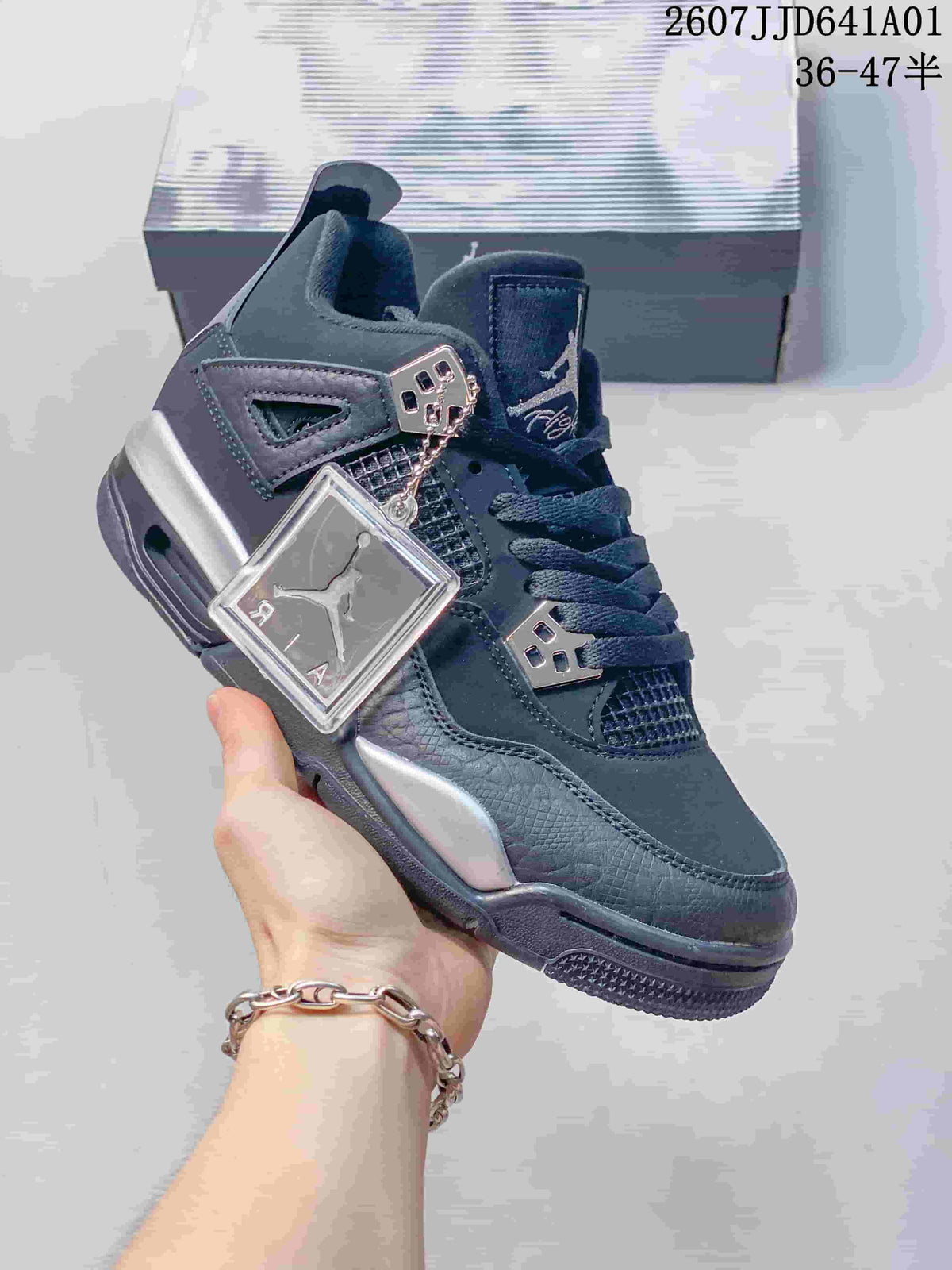 Angled view of the dark black and silver sneaker with hangtag