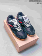 Pair of black low-top sneakers with red accents, white laces, gum outsoles and a box; image text shows style code 2607JYD625A15 and size range 36–45.
