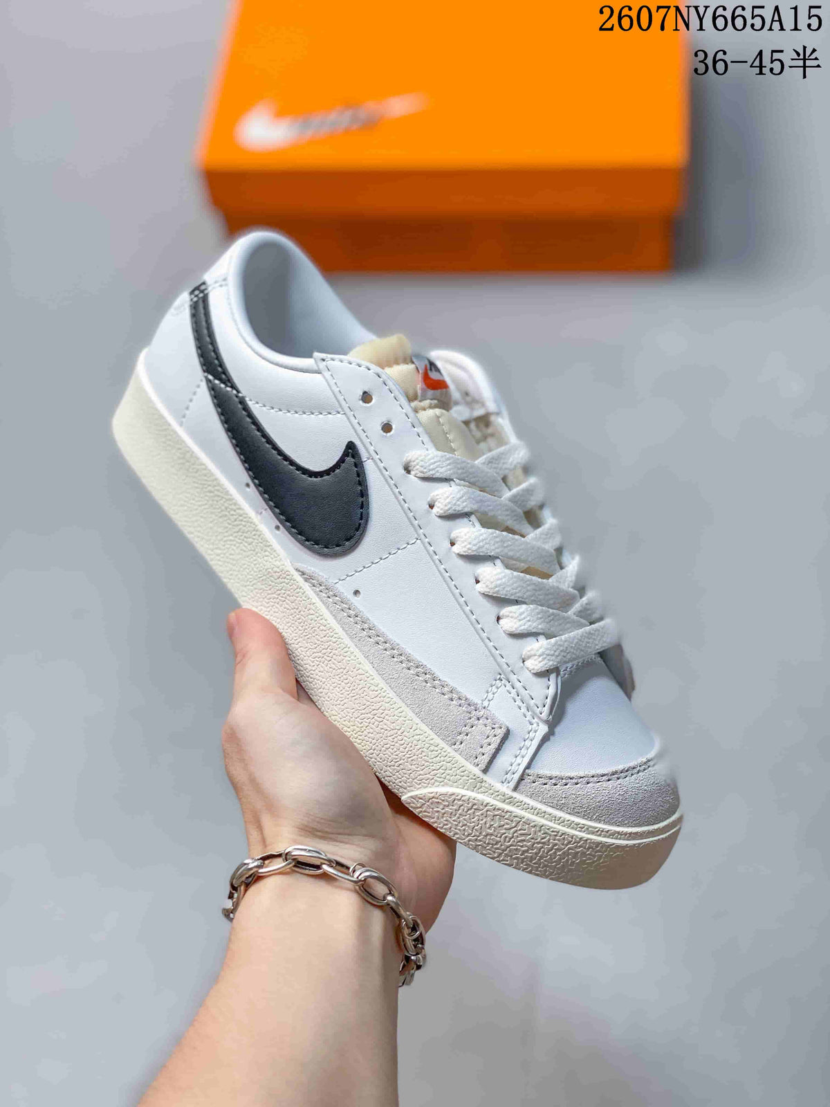 Angled side view showing the black Swoosh, stitched panels and rubber outsole.