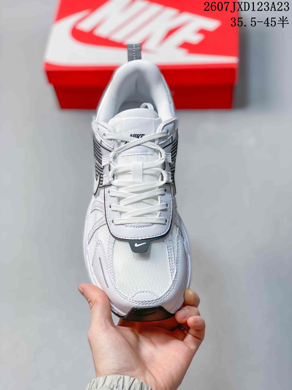 Top view showing the white laces, padded tongue, layered toe area, and black toe accent.