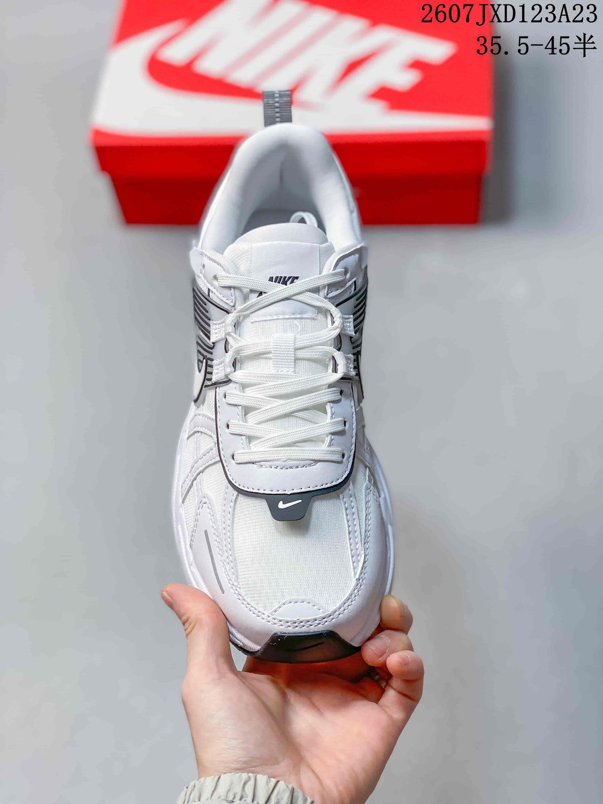 Top view showing the white laces, padded tongue, layered toe area, and black toe accent.