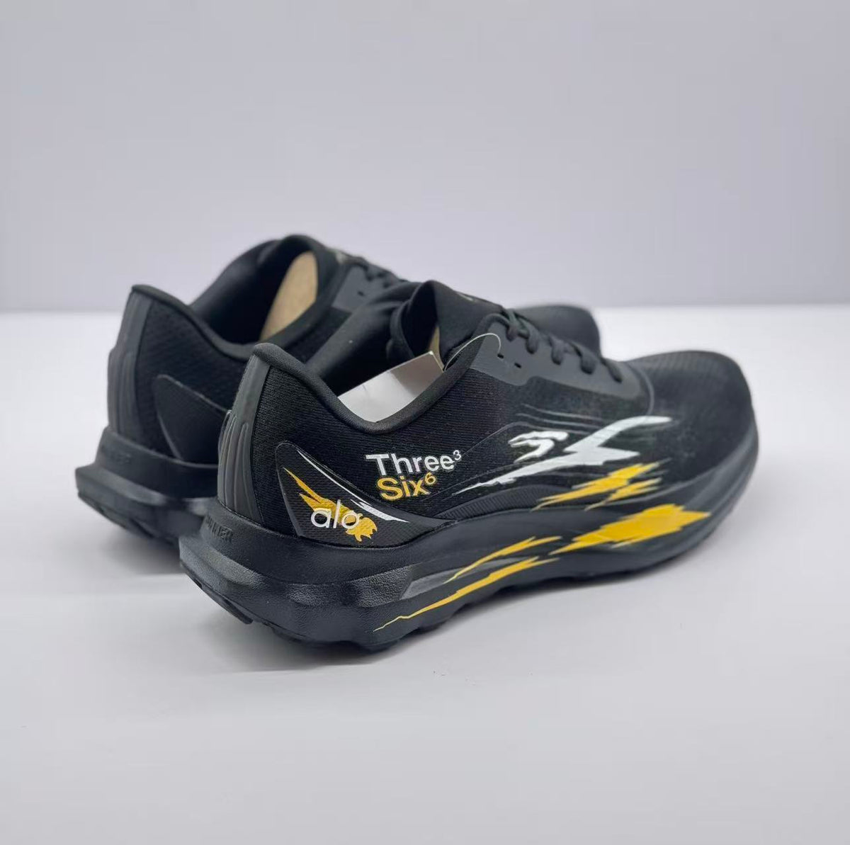 Rear three-quarter view showing the padded heel sections, outsole shape and side graphics.
