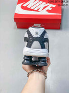 Rear view of the sneaker showing the pod-style heel and layered upper