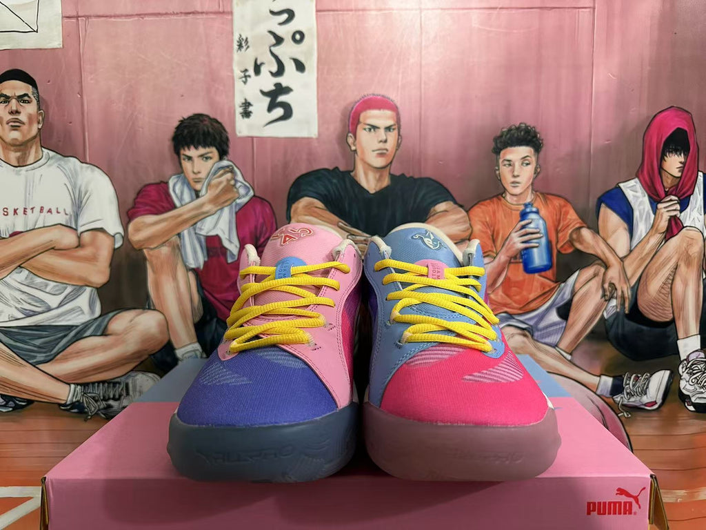 Front view of mismatched pink and blue PUMA basketball shoes with yellow laces.