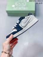 Side profile showing the white side overlay, dark navy panels, white midsole, and patterned outsole.