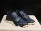 Three-quarter view of the dark black and navy sneaker pair with blue details and cream outsoles.