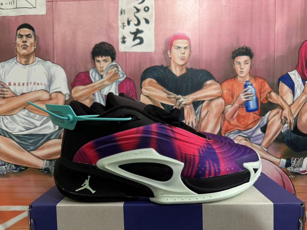Side view of a Jordan Tatum basketball shoe with a purple-pink patterned upper, black heel, and pale green side support.