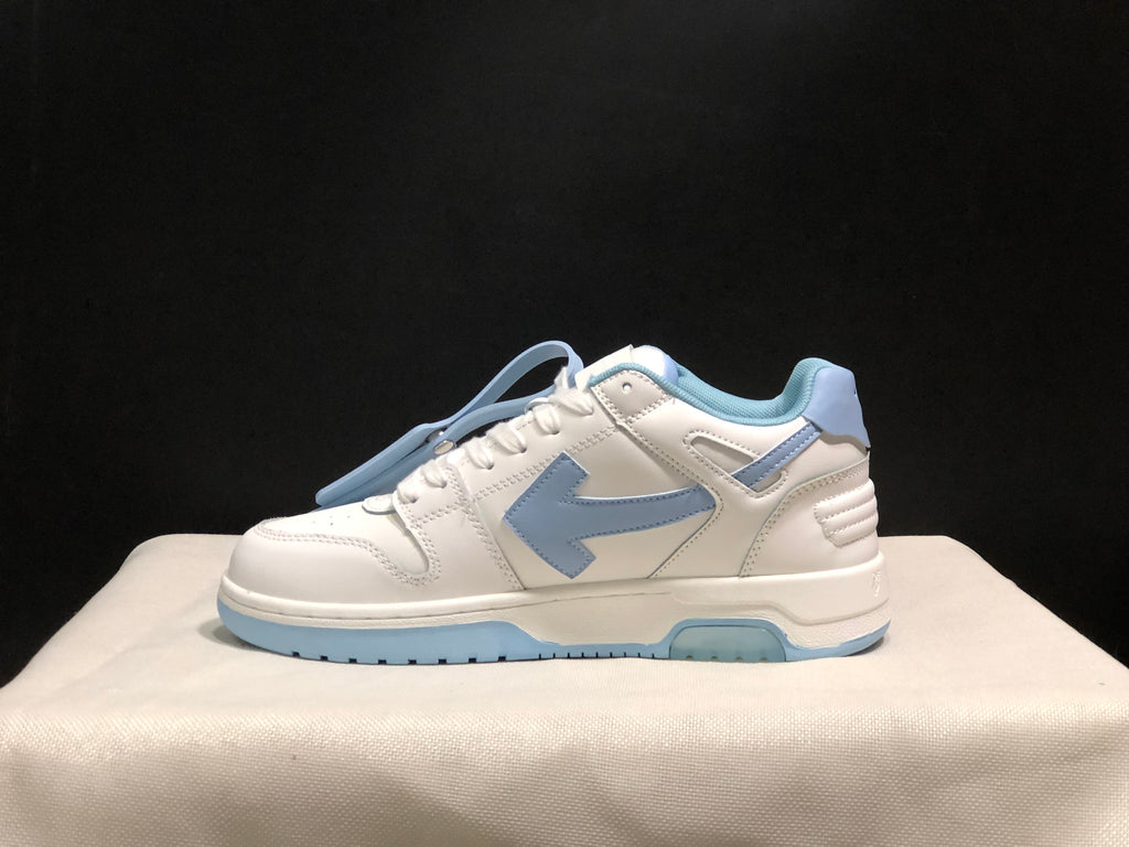 Side profile showing the low-top silhouette, layered white panels, light blue side detail and segmented outsole.