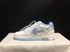 Side profile showing the low-top silhouette, layered white panels, light blue side detail and segmented outsole.