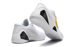 All-white shoes shown from the heel and outsole.