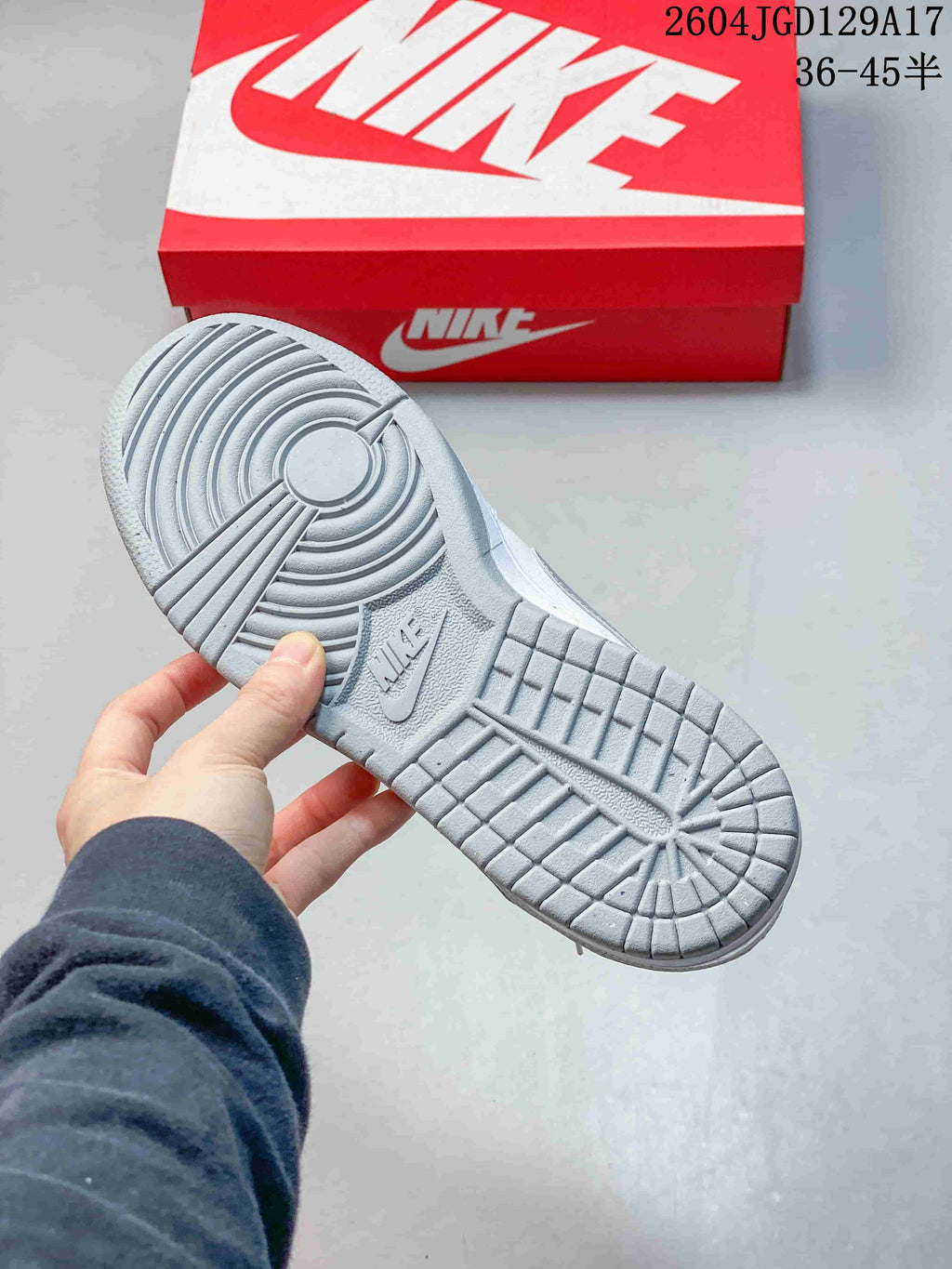 Grey patterned outsole of a Nike low-top sneaker