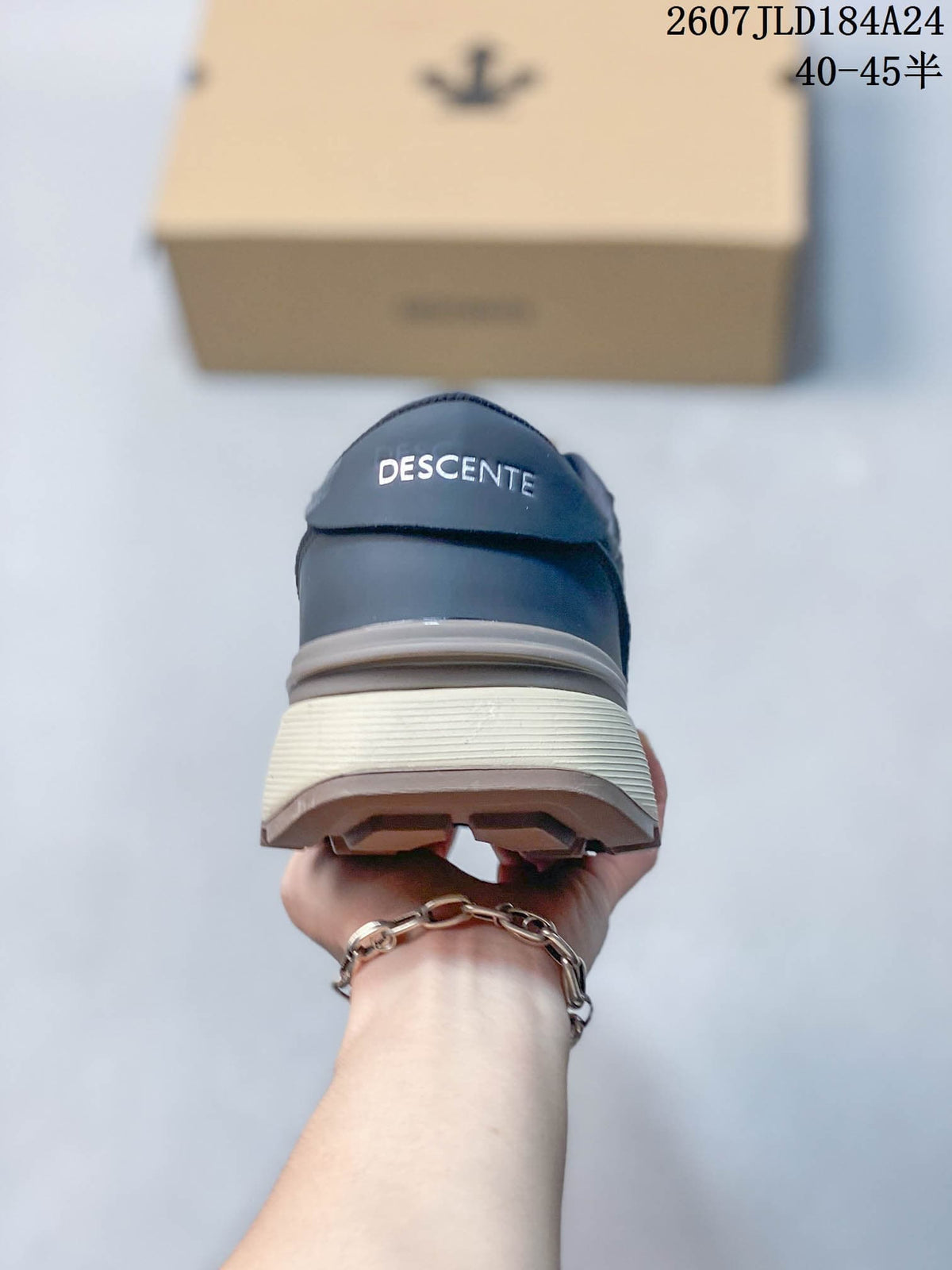 Rear view of the navy sneaker showing DESCENTE branding, layered heel construction and textured outsole.