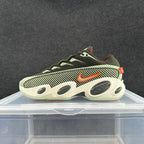 Side view of an olive, cream, and orange Nike Zoom Flight 95 sneaker with patterned side panels.