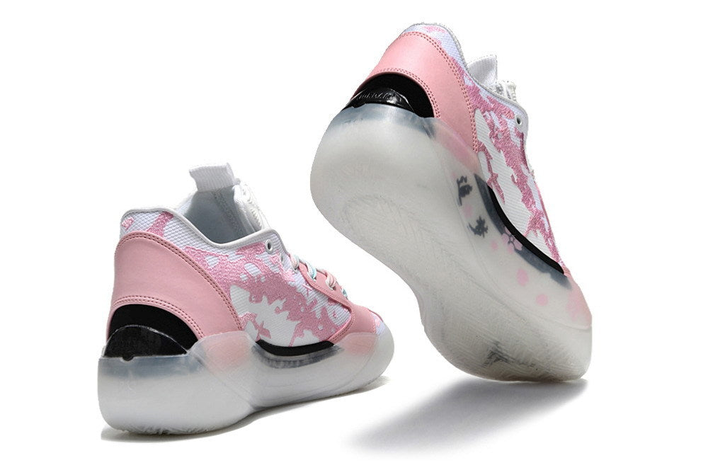 Pink and white Jordan 39 shoes shown from the heel and sole.