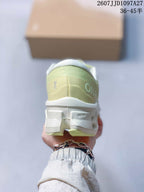 Rear view of the sneaker showing the padded heel, On branding and segmented sole structure.