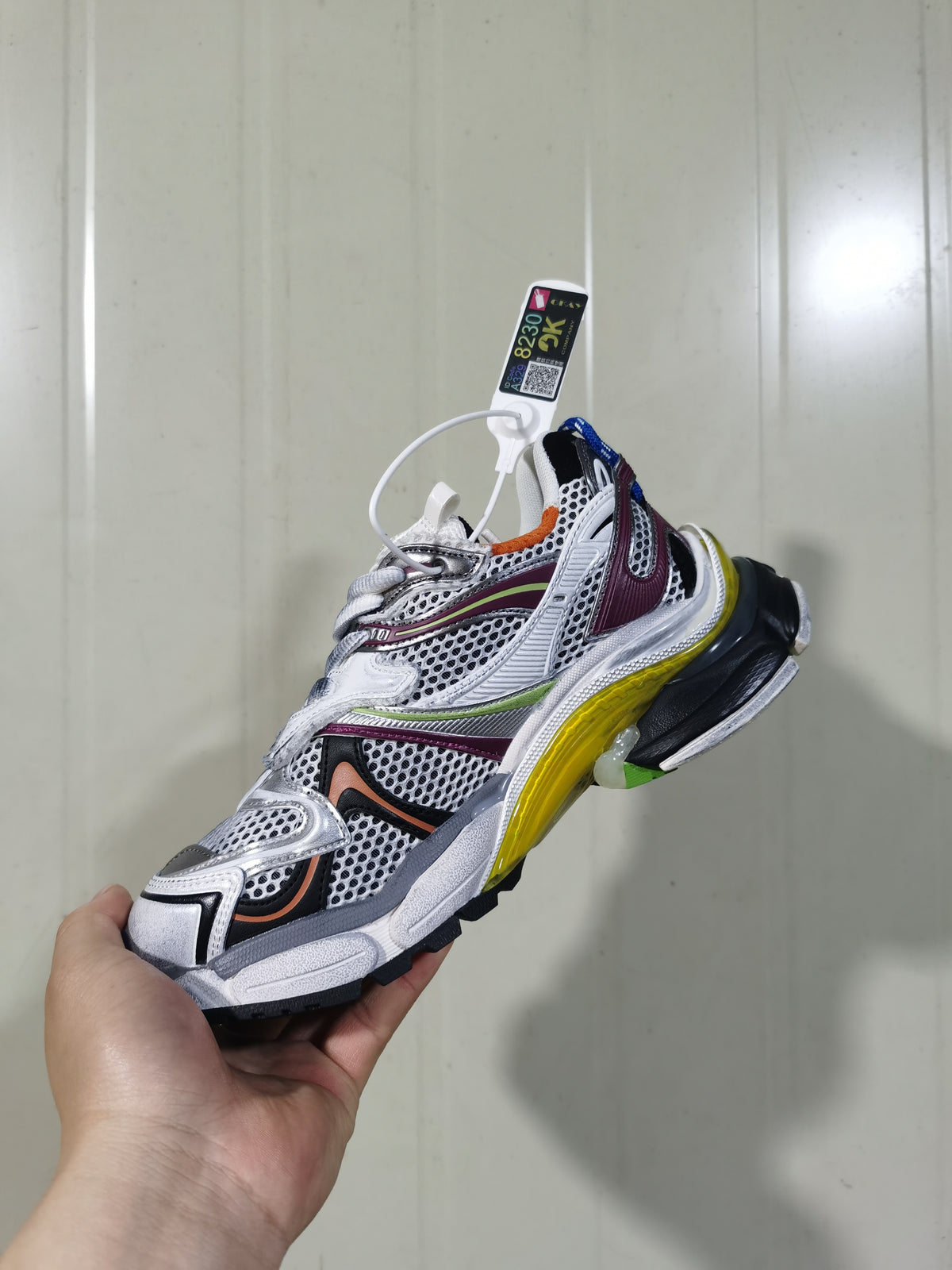 Side and top view of the multicolor Balenciaga Runner sneaker with contrasting burgundy, lime green, orange, blue, yellow and black details.