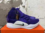 Side view of a purple high-top Nike basketball shoe with a white midsole and black Swoosh