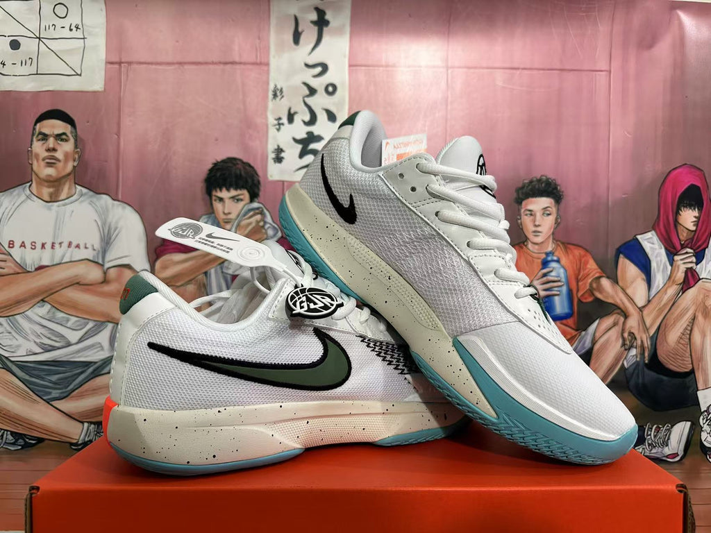 Angled view of two white Nike basketball sneakers showing the dark green and black swoosh, speckled midsoles, and blue-green outsoles.