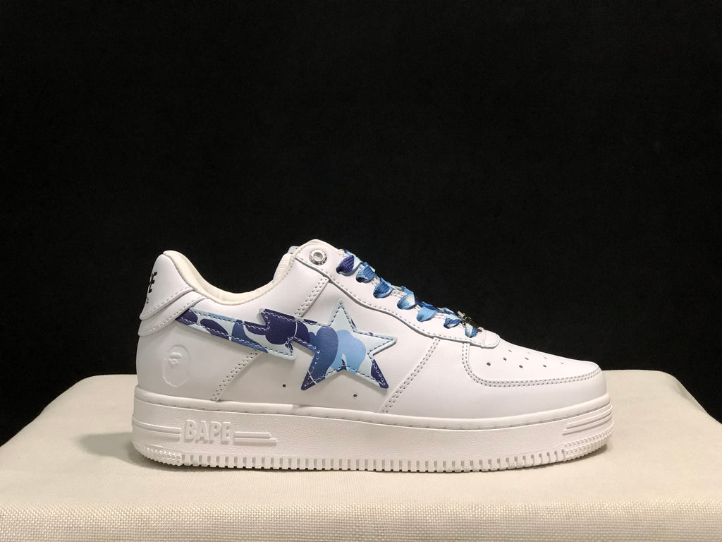 Opposite side profile of the white sneaker showing the blue camouflage star and side-panel design.