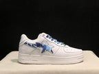 Opposite side profile of the white sneaker showing the blue camouflage star and side-panel design.