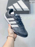 Black and white adidas Adipista low-top sneaker shown at an angle with stitched panels and three side stripes.