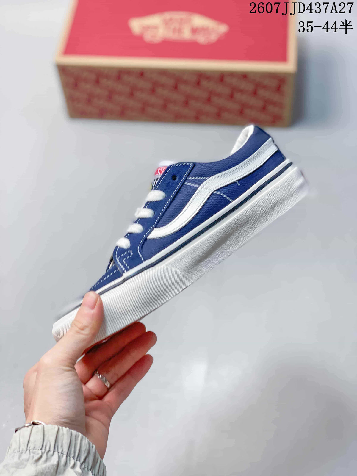 Side profile of the blue and white low-top sneaker showing the contrast stripe, stitching, and white sole.