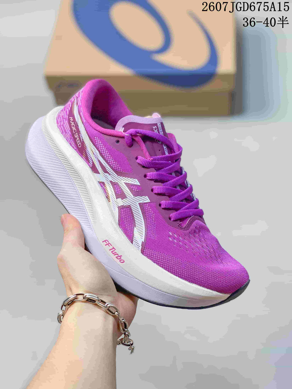 Purple and white ASICS Magic Speed 4 running shoe with a contrasting logo and sculpted white midsole.