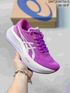 Purple and white ASICS Magic Speed 4 running shoe with a contrasting logo and sculpted white midsole.