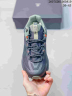 Top view showing the padded tongue, lace arrangement, mesh-style upper, and contrasting orange details.