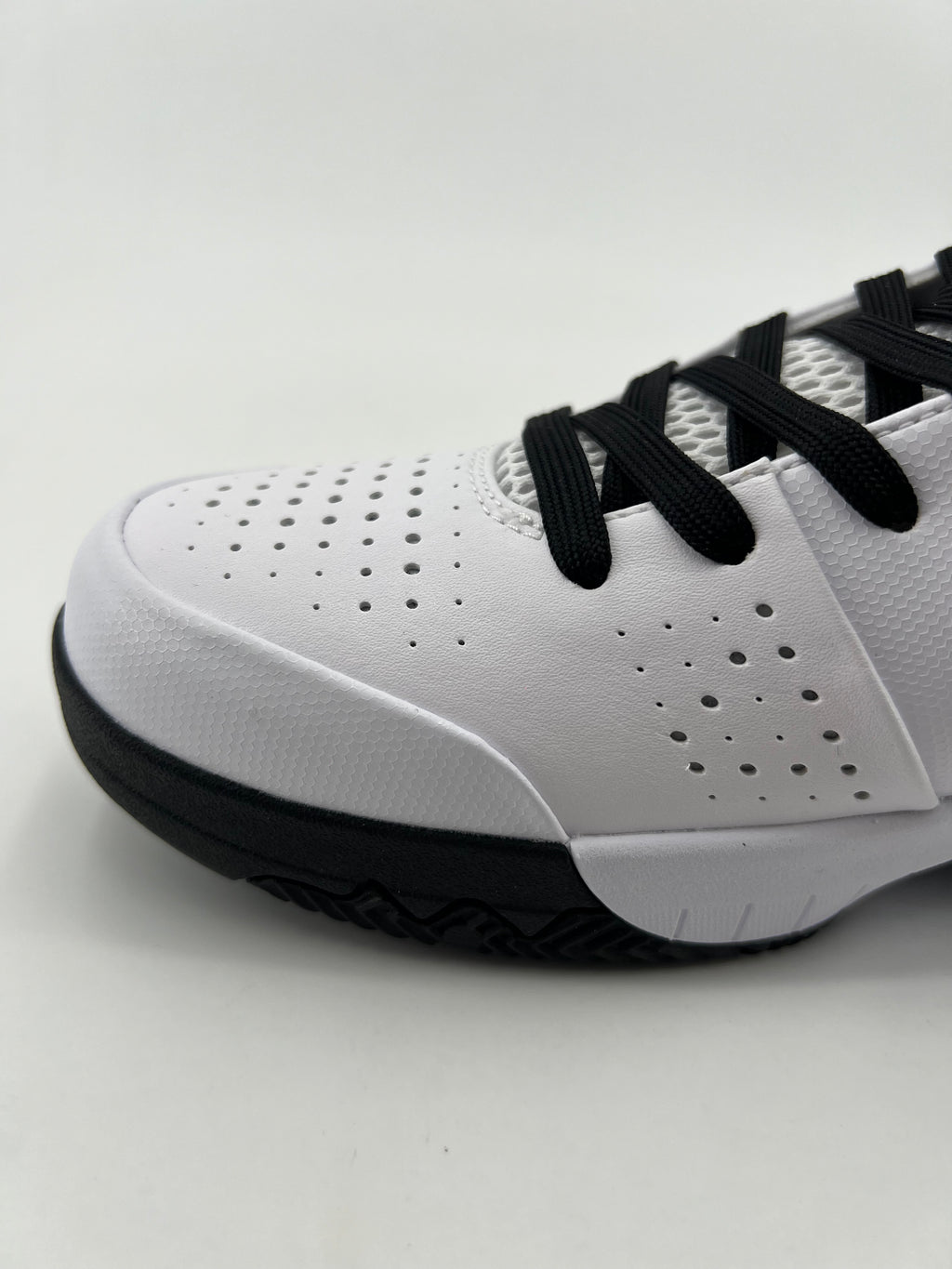 Close-up of the perforated toe and black laces