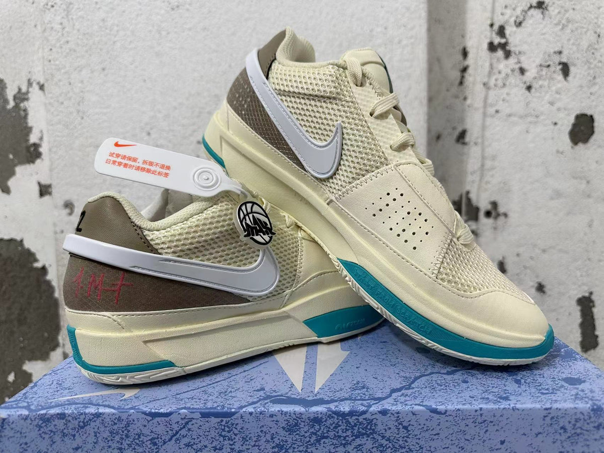 Nike Ja 1 shoes displayed together, showing the cream upper, white Swoosh, and teal details