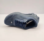Top view of one dark blue Alo sneaker highlighting the lace arrangement, tongue branding, and perforated-looking upper pattern.