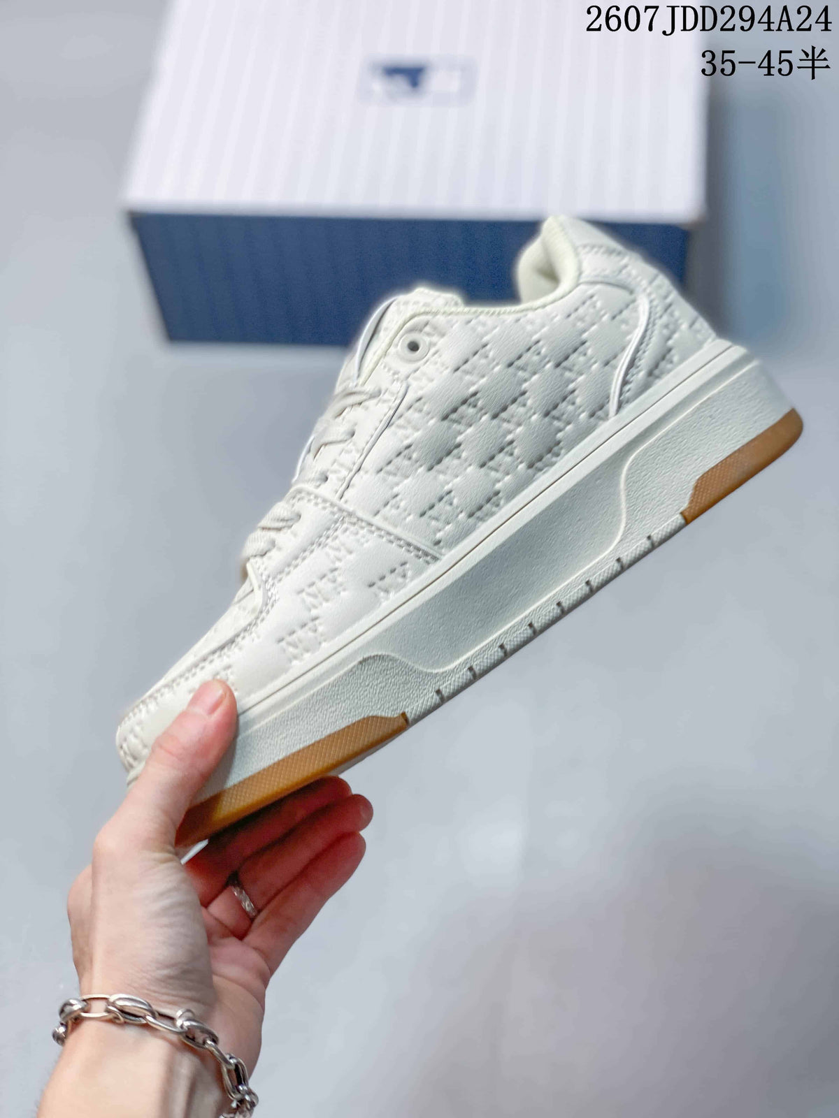 Side profile of the white MLB sneaker showing the textured upper, raised white sole, and gum-colored outsole sections.