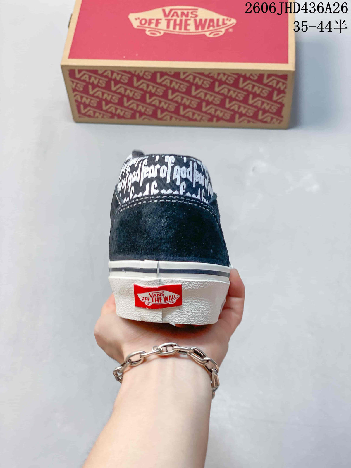 Rear view showing the text-patterned upper and Vans heel label.