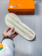 Close-up of the textured herringbone outsole and Nike Swoosh tread pattern.