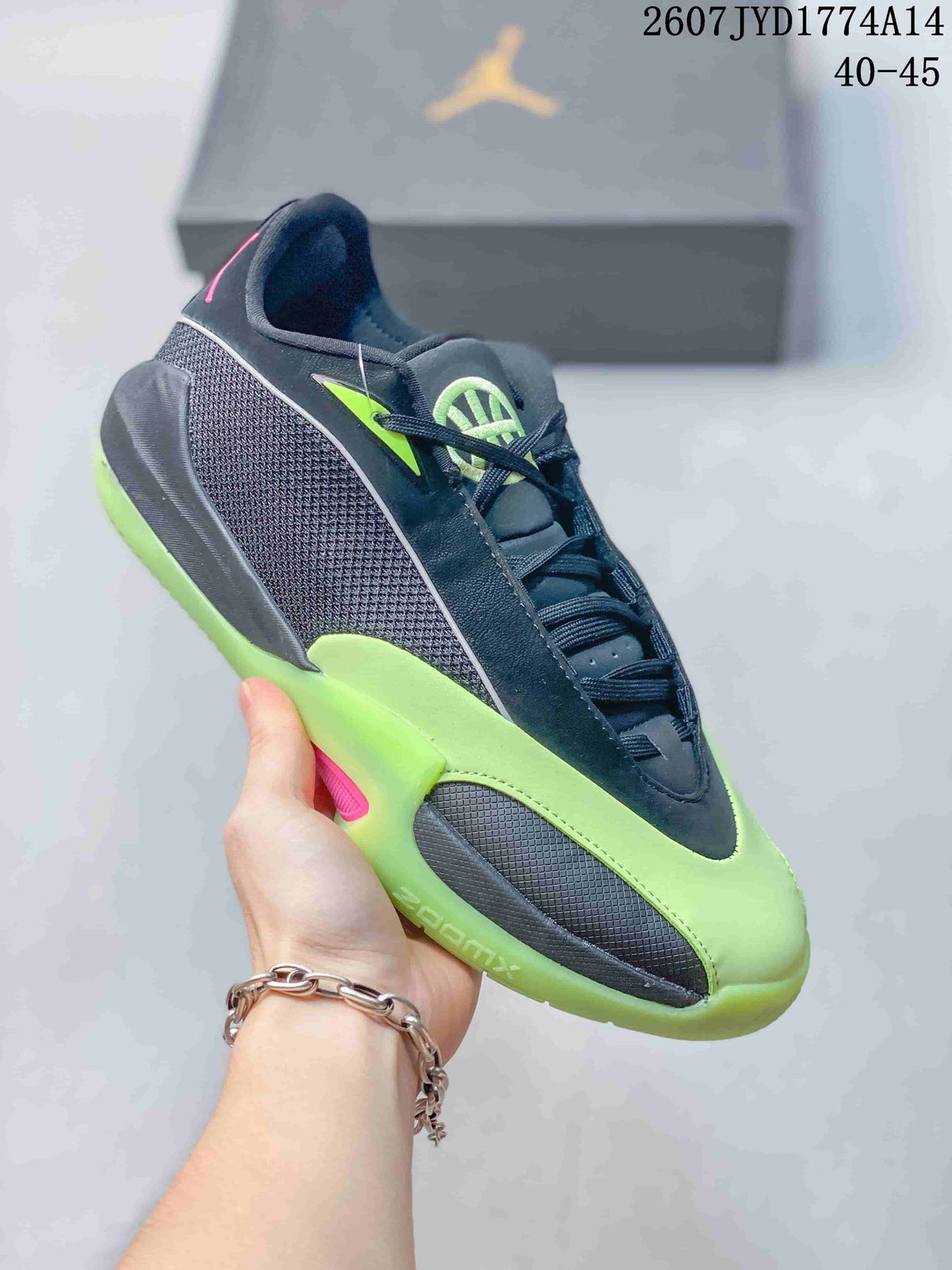 Side view of a black and neon green Jordan Triangle basketball shoe showing its mesh panel, lace-up upper, and textured outsole.