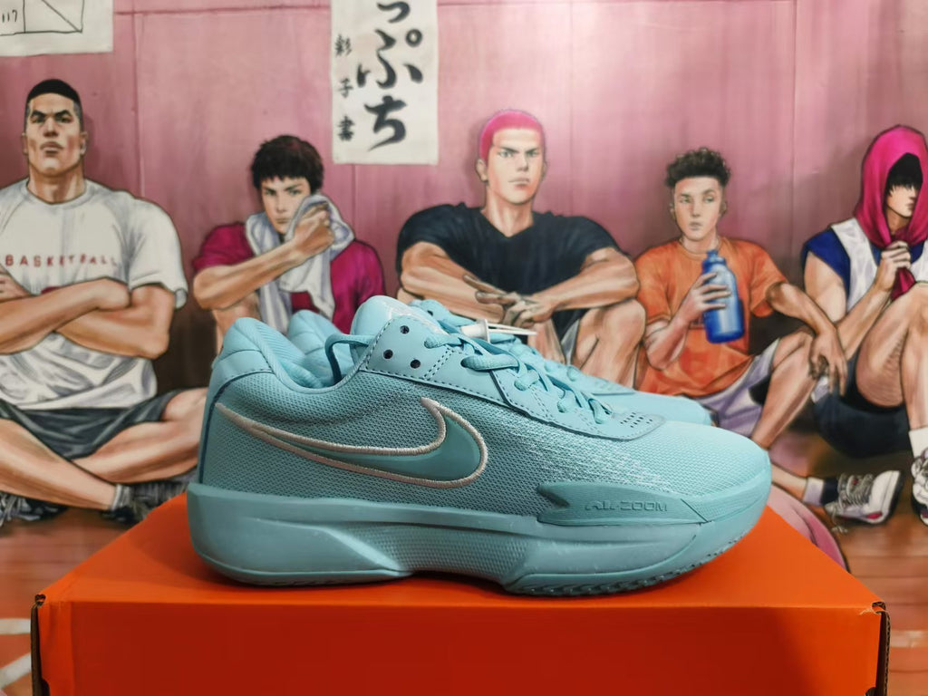 Side profile of a blue Nike basketball shoe with a contrasting Swoosh and visible Zoom marking.