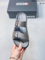 Top view of one taupe-gray ECCO sandal with two buckled straps and printed footbed graphics.