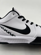 Side view of the white basketball shoe with black Swoosh and sole accents