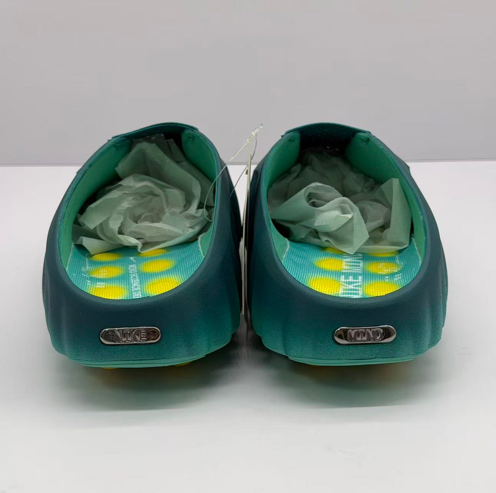 Rear view of the pair with green interiors, printed footbeds, and heel plaques.
