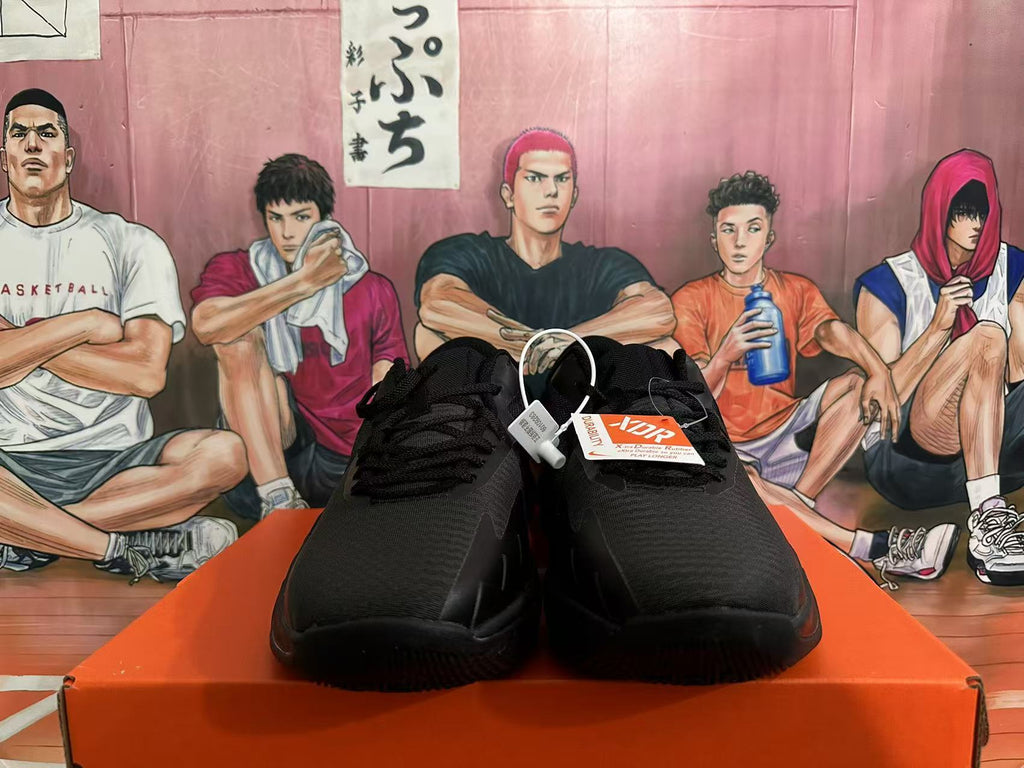 Front view of black Nike basketball sneakers with lace-up closure