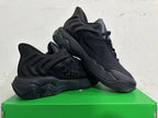 Pair of black sneakers displayed together, showing the side panels and soles.