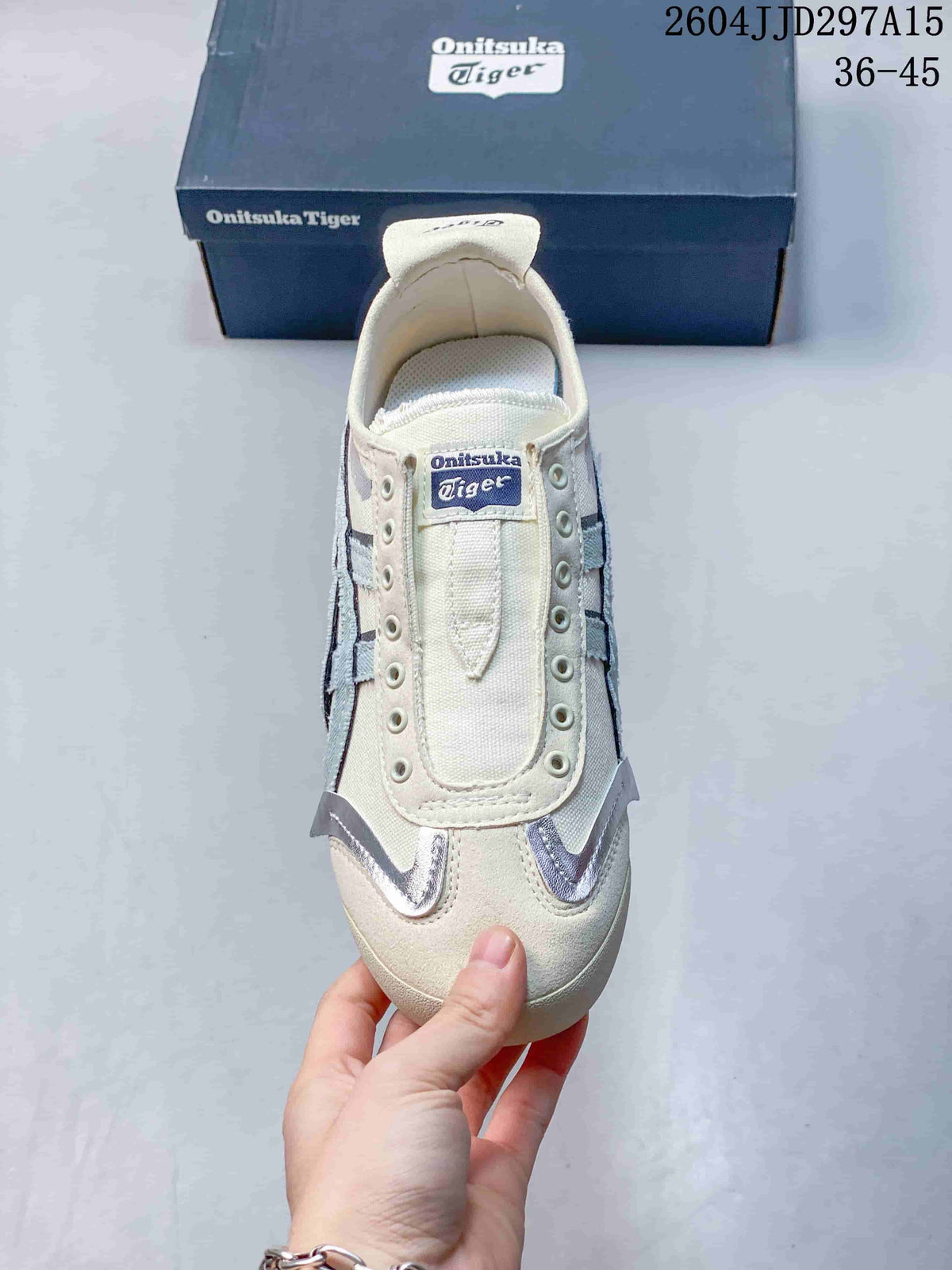 Top view showing the padded tongue, open eyelet detail, cream textile upper, and silver-look toe accents.