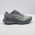 Side view of a gray Alo Runner sneaker showing the lace-up upper, layered side detailing, padded collar, and thick outsole.