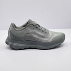 Side view of a gray Alo Runner sneaker showing the lace-up upper, layered side detailing, padded collar, and thick outsole.