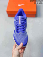 Top view of the blue running shoe showing the mesh-like toe box, laces and contrasting orange tongue detail.